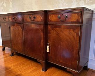 C44- $300.  Trosby Furniture from Sussex England. Buffet With Key a few minor scratches on top.  A beautiful solid piece.   Measures 6' long x 17" deep x 33.5" tall. 