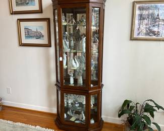C9 - $175. Glass Front Lighted Curio cabinet with glass shelves. Two door entry (top & bottom).  Measures 31" wide x 15 deep x 78" tall. 