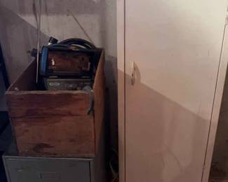 Metal Cabinet, Wooden Crate,Amphenol Tv Tester, Two Drawer Storage.