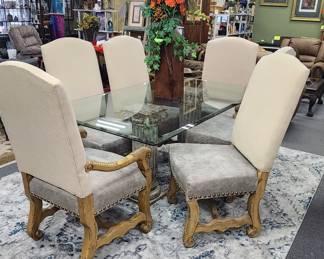 Glass top dining table with 6 upholstered chairs