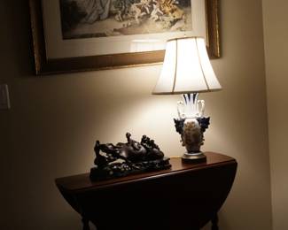 Gate leg table, carved wood asian oxen and a print by