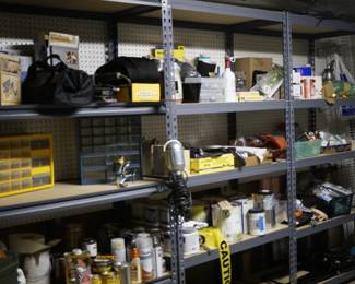 Metal shelving, some tools, electrical outlets and switches