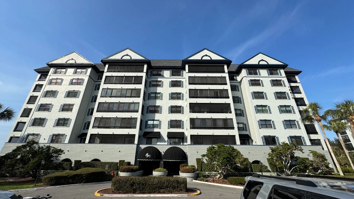 The front of the building. The main entrance is under the black canopy.