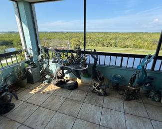 Rear patio featuring tons of unique aquatic themed figures and statues. Perfect for your home or garden.
