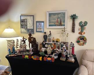 We have ships, sailors, light houses, brass birds, copper palm tree & lobster, sail boat painting, carved wooden pieces. Something for everyone !!