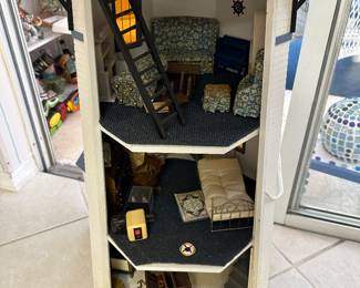 Have fun with this light house that has furniture in the back