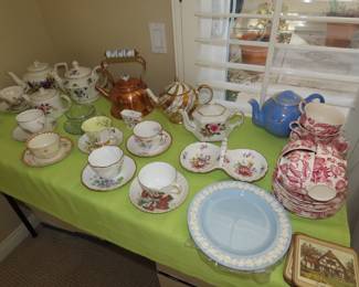 Tables of bone china and decorative items.
