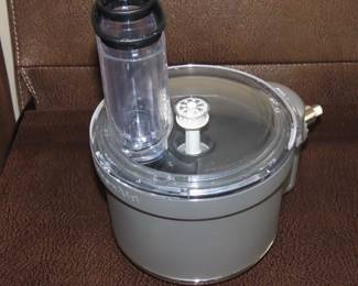 KitchenAid Professional 550 HD Mixer on stand with attachments.