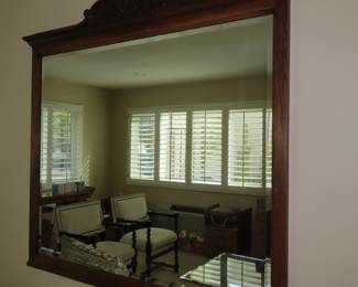 Framed wall mirror.