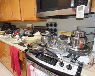 Very full kitchen with many items new in boxes.