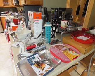 Very full kitchen with many items new in boxes.