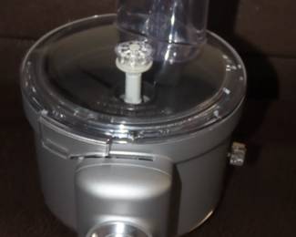 KitchenAid Professional 550 HD Mixer on stand with attachments.