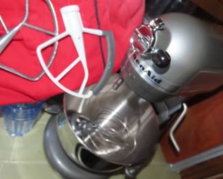 KitchenAid Professional 550 HD Mixer on stand with attachments.
