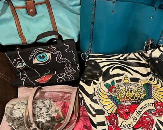 Various purses, including Ted Baker.