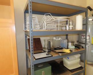 Metal and wood shelves. Plate racks. plastic containers.