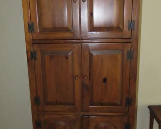 Tall wood cabinet.