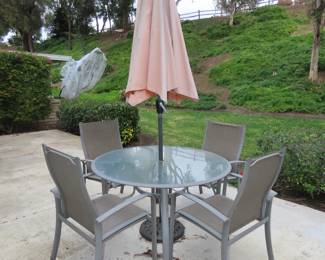 Patio table/chairs and umbrella.