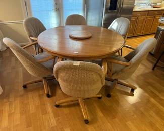 Chromcraft Bailey Carlisle Round Dining Table (54"W x 29"H) with 6 Upholstered Armchairs on Casters (25"W x 36"H x 27"D each)