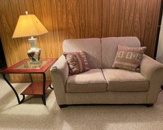 Ashley Furniture Upholstered Loveseat (58"W x 36"D x 35" Back Height) Ashley Furniture 2 Tiered Glass Top Side Table (pr)
