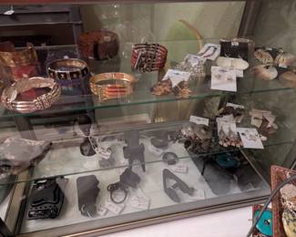 Jewelry, pistol grips, holsters