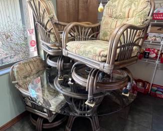 Dinette Set: 48 inch beveled glass top table with four chairs on casters. Close up of fabric in next photo --->
