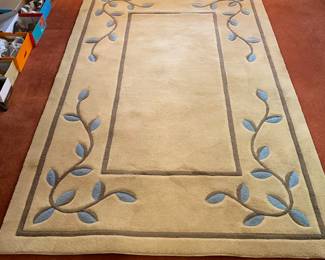 Tan carpet with leaf motif