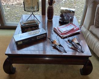Large wooden coffee table with Asian inspired flavored legs