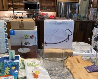 Many beautiful serving pieces still in boxes