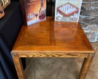 Wooden end table with brass corner accents