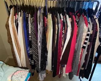 Our racks are bursting with clothing in many rooms! So many choices!