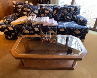 80s wooden coffee table with glass top and butterfly candle holder