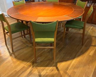 DRYLUND ROUND TEAK “LOTUS” OR “FLIP FLAP” DINING TABLE W/HIDDEN LEAVES