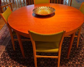DRYLUND ROUND TEAK “LOTUS” OR “FLIP FLAP” DINING TABLE W/HIDDEN LEAVES