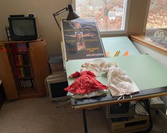 2 drafting tables. VHS cabinet. 
