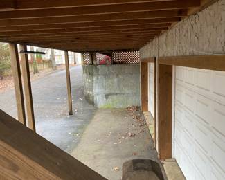 Covered storage under screened in porch. 