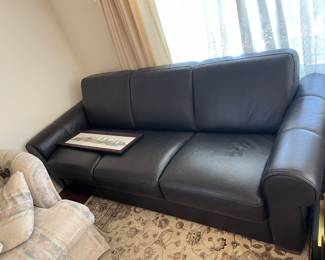 This leather couch lays down flat to become a bed!