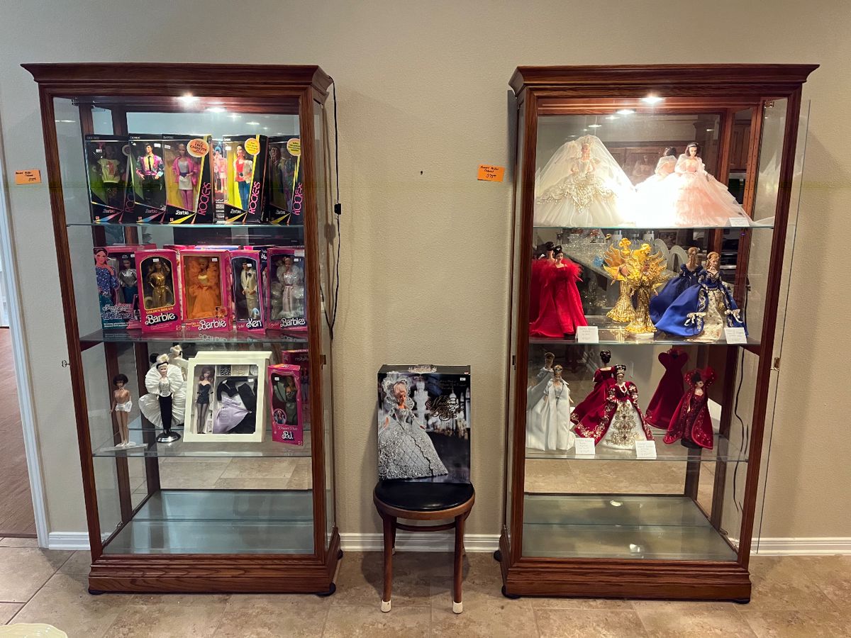 Our HUGE Barbie collection begins inside these two matching HOWARD MILLER display cases!