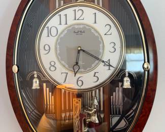 Small World Rhythm Solo Organist Clock