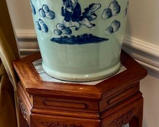 One of two vases and stands for sale