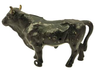 antique metal bull used to pull cart