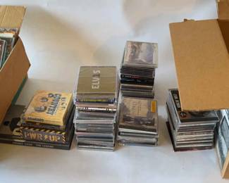 A Plethora Of CDs Featuring Many Unopened Discs