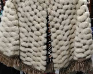 Faux fur cape, more faux fur coats, jackets and vests available.