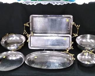 Hammered silver plate serving pieces with gold handle accents