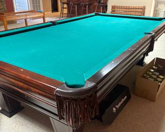 Ventura by Brunswick billiard table with leather pockets, and accessories