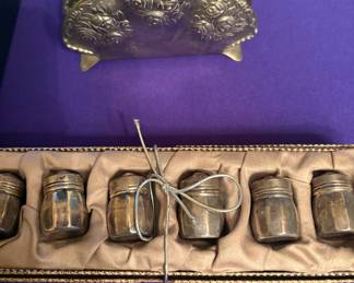 Sterling salt shakers and napkin holder