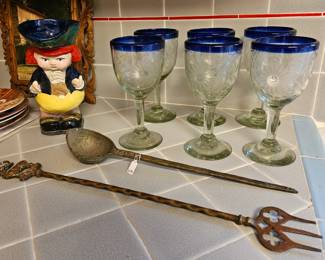 Rose Ann Hall stemware with blue rim and etched flowers