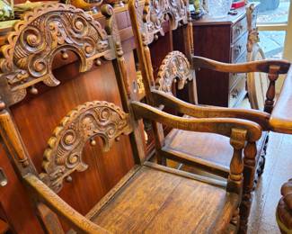 Unusual chairs. Four side chairs and two host chairs with arms.