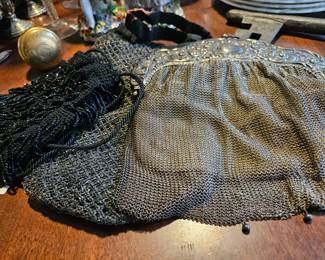 (Left )Miser's purse, Beads on horsehair (center), and mesh handbag (right).