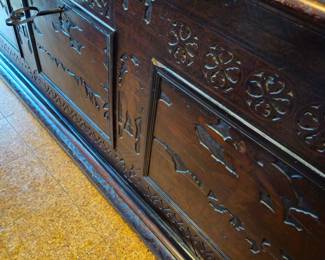 View of the front of the chest with the key in the lock.