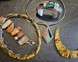 Tiger eye necklaces, Frank Yellow Horse sterling cuffs. Sterling necklace wire. Bracelet and heavy tiger eye are sterling.